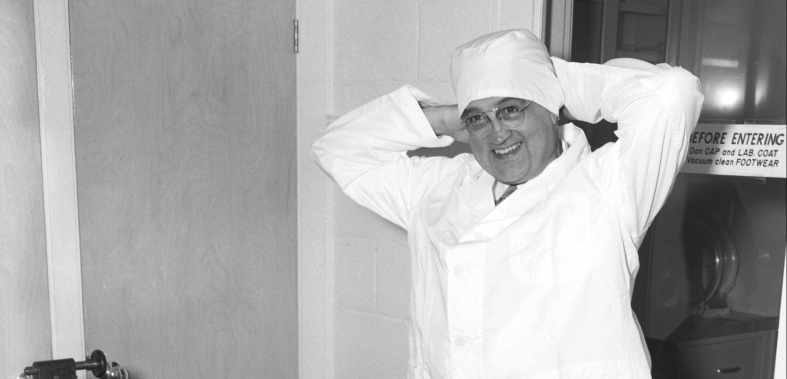 Dr. Draper Putting On Clean Room Suit Dr. Draper Putting On Clean Room Suit