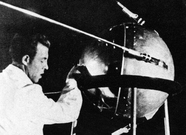 Engineer with Sputnik 1 Satellite