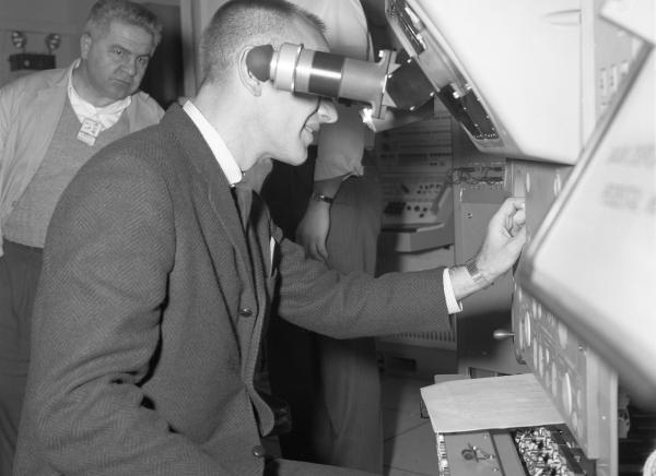 Astronaut Testing the Primary Guidance, Navigation, and Control System Simulator Astronaut Testing the Primary Guidance, Navigation, and Control System Simulator
