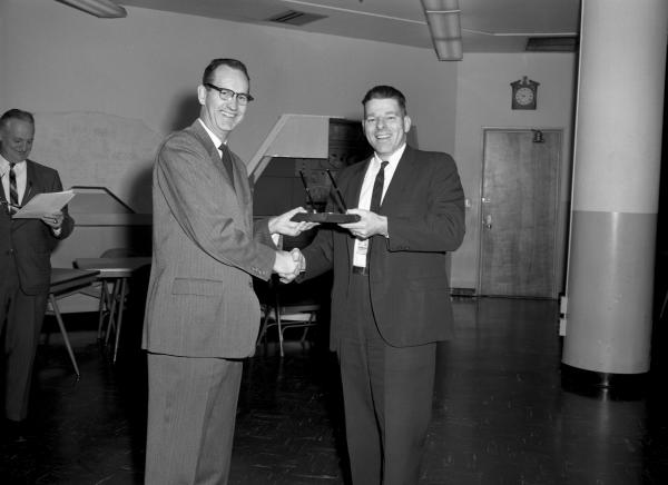 Ralph Ragan Presenting George Mayo with the 3% Cost Reduction Award Ralph Ragan Presenting George Mayo with the 3% Cost Reduction Award