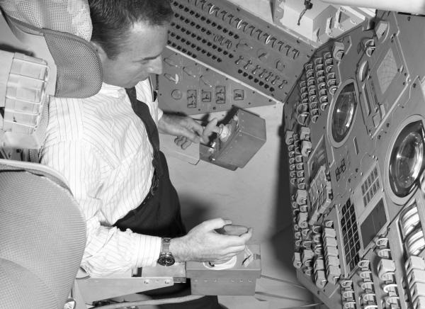 Astronaut Jim Lovell in the Command Module Simulator Astronaut Jim Lovell in the Command Module Simulator