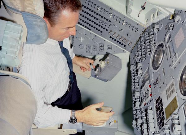 Astronaut Lovell in Command Module Simulator Astronaut Lovell in Command Module Simulator