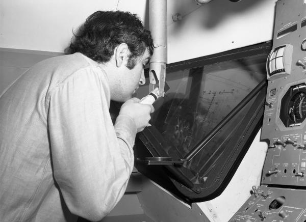 Man Viewing Launching Sight Designator in Apollo LEM Man Viewing Launching Sight Designator in Apollo LEM