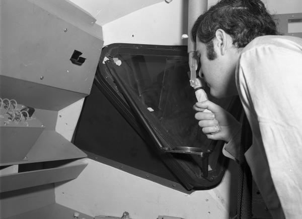 Man Viewing Launching Sight Designator in Apollo LEM Man Viewing Launching Sight Designator in Apollo LEM