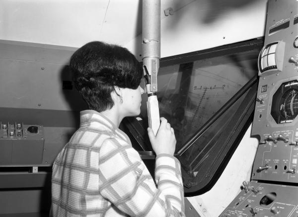 Woman Viewing Launching Sight Designator in Apollo LEM Woman Viewing Launching Sight Designator in Apollo LEM