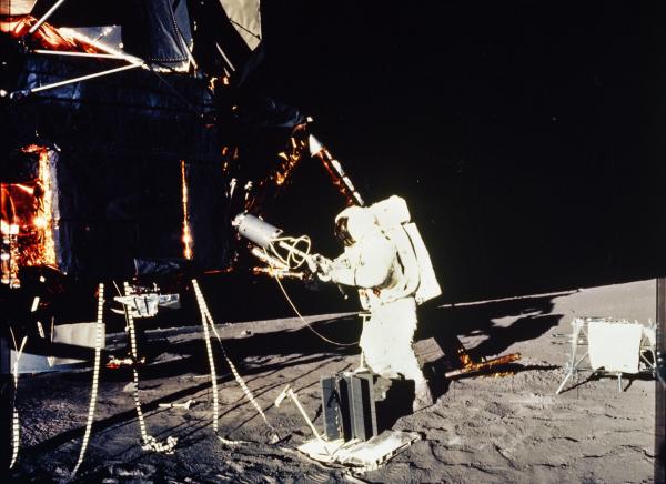 Apollo 12 Astronaut with Scientific Equipment on the Lunar Surface Apollo 12 Astronaut with Scientific Equipment on the Lunar Surface