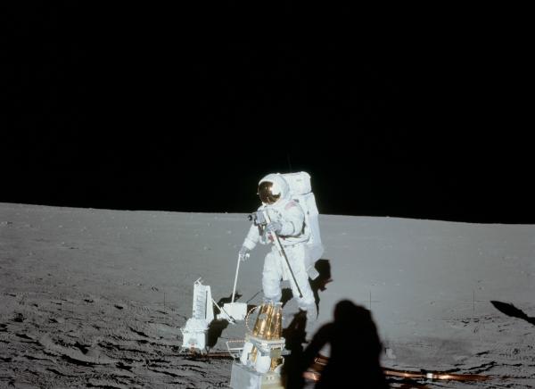 Apollo 12 Astronaut Alan Bean Deploys Apollo Lunar Surface Experiments Package Apollo 12 Astronaut Alan Bean Deploys Apollo Lunar Surface Experiments Package