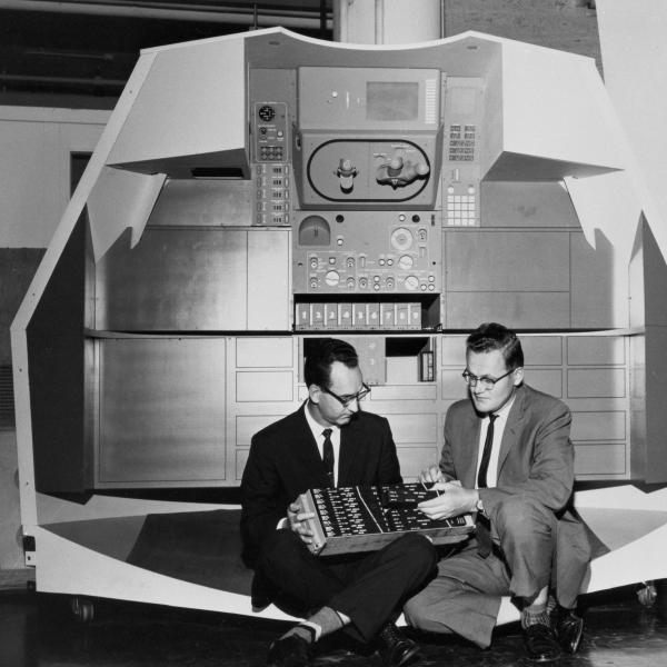 Ragan & Hall Seated In Front Of A Mock-up Of Apollo Controls